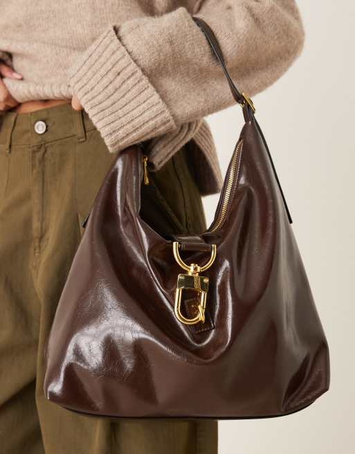 Statement buckle slouch tote bag in chocolate