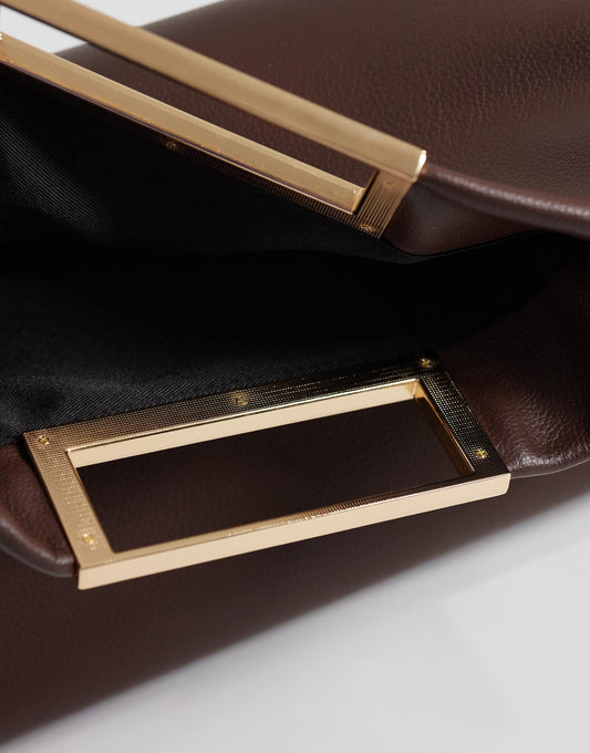 Oversized metal handle clutch in chocolate