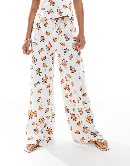 ASOS DESIGN broderie trouser with tie waist in white orange print